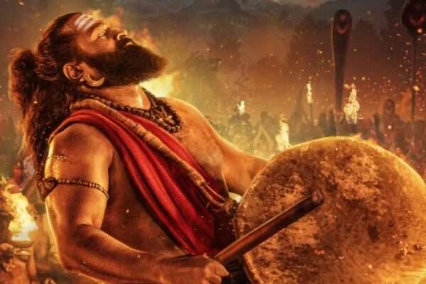 Kantara movie poster featuring main cast and scenic village background