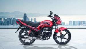 Hero Passion Plus Standard variant side view on road